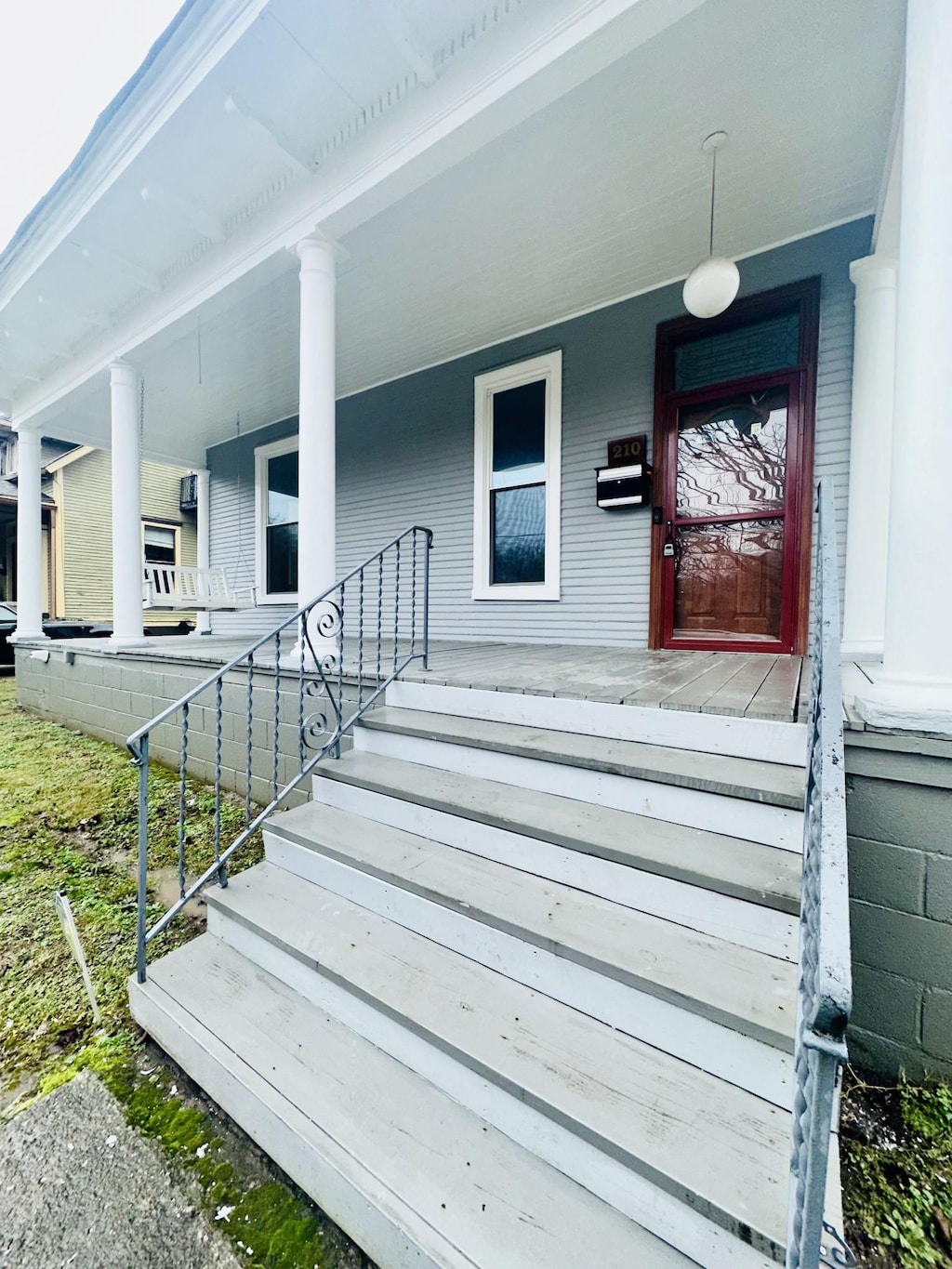 doorway to property with a porch