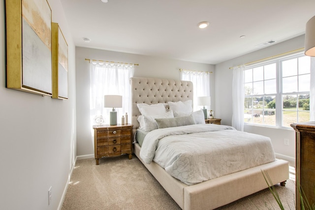 bedroom featuring light carpet