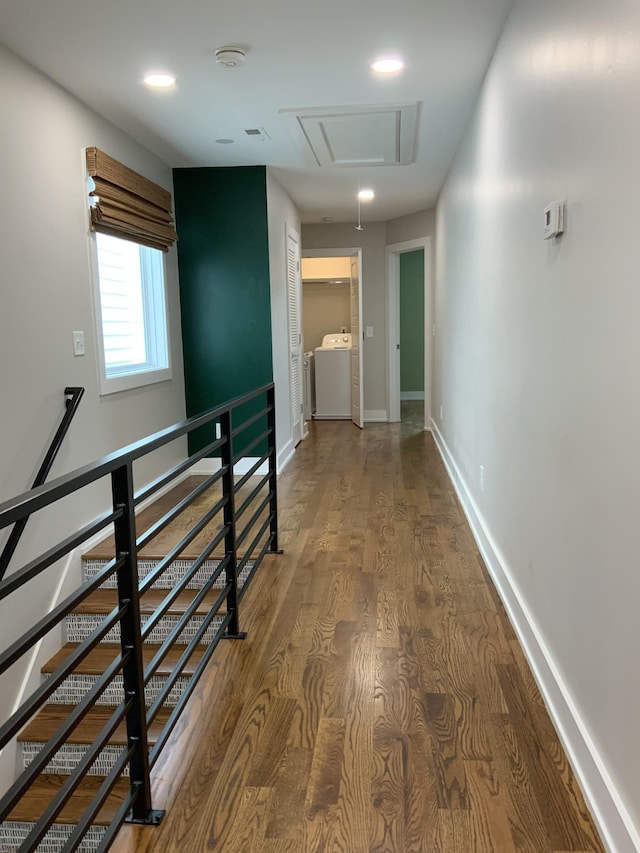 hallway featuring washing machine and dryer and hardwood / wood-style floors