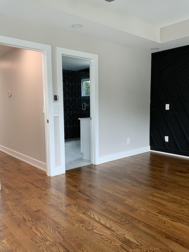 unfurnished room featuring dark hardwood / wood-style floors