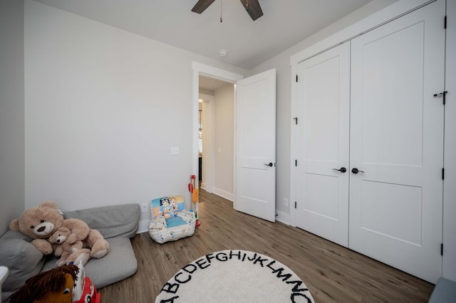 interior space featuring hardwood / wood-style floors and ceiling fan