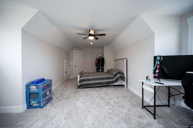 bedroom featuring ceiling fan, lofted ceiling, and carpet