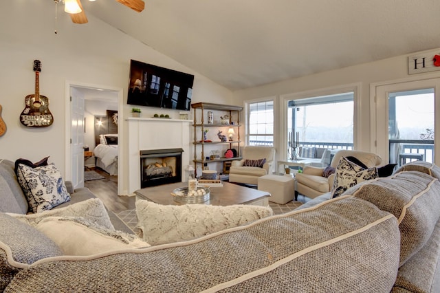 living room featuring vaulted ceiling and light wood-type flooring