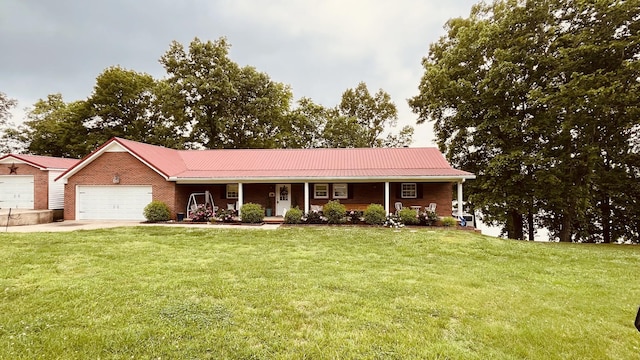 194 Lakeshore Cir, Bumpus Mills, TN 37028 - ranch-style home featuring covered porch, a garage, a front yard, and metal roof
