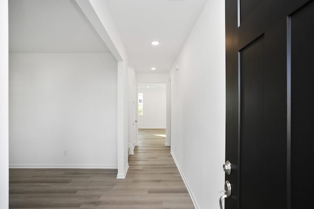 hallway featuring hardwood / wood-style flooring