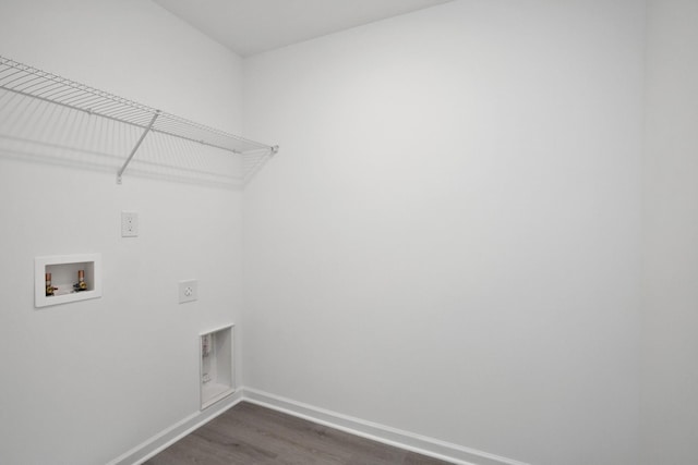 washroom with hookup for an electric dryer, dark hardwood / wood-style floors, and washer hookup