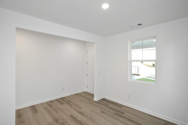 spare room with light hardwood / wood-style floors