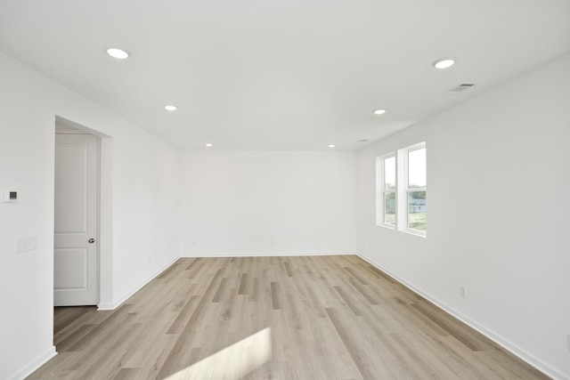 spare room featuring light hardwood / wood-style floors