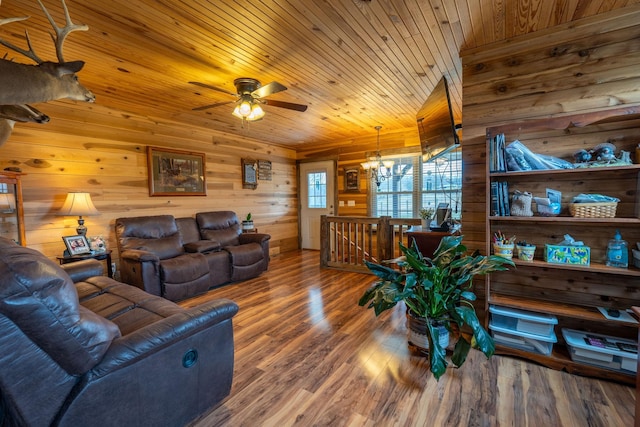 living room with wood ceiling, hardwood / wood-style flooring, wooden walls, and a notable chandelier