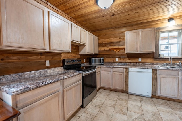 kitchen featuring appliances with stainless steel finishes, sink, wood ceiling, and light brown cabinetry