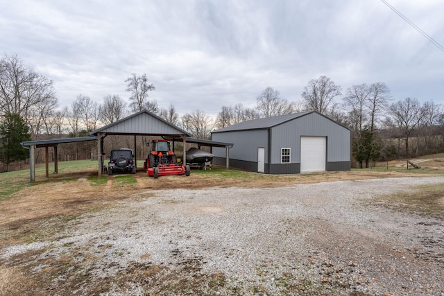 view of outbuilding with a garage and a carport