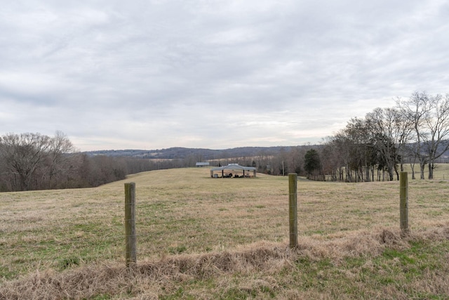 mountain view featuring a rural view