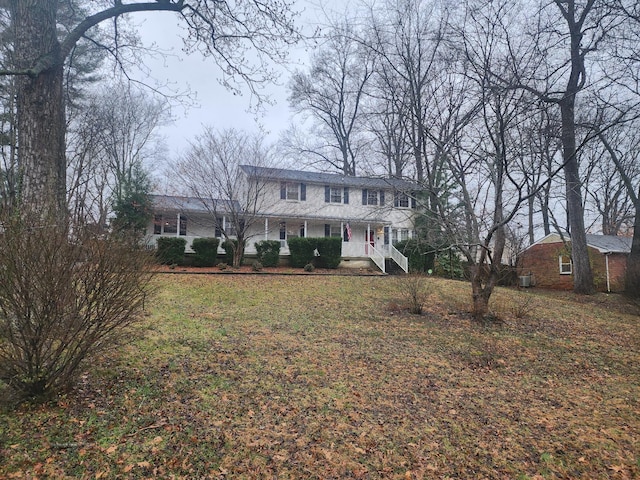 colonial-style house with a front yard