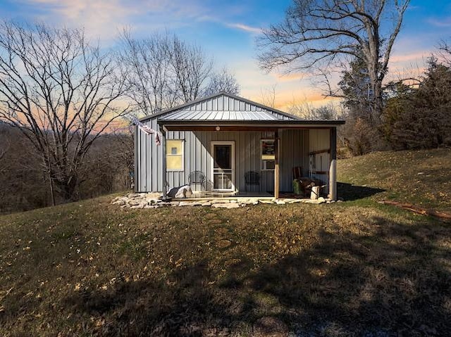 474 Bartlett Hollow Rd, Petersburg, TN 37144 - outdoor structure at dusk featuring a porch
