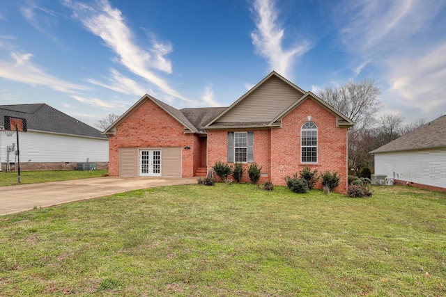 view of front of house featuring central AC, a front yard, and french doors