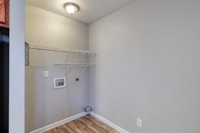 laundry room featuring wood-type flooring, electric dryer hookup, and washer hookup