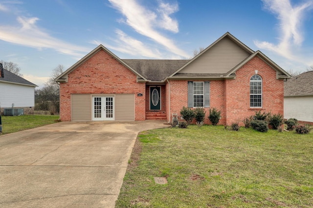 view of front of house with french doors, a front yard, and central air condition unit