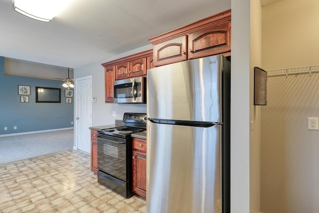 kitchen with ceiling fan and stainless steel appliances