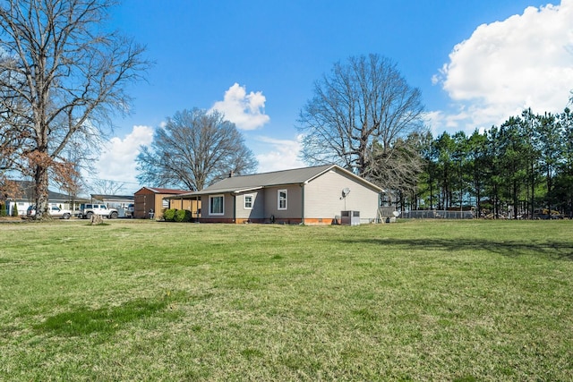 exterior space with a front lawn and fence