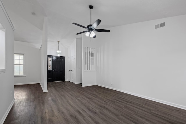 foyer entrance featuring dark wood-type flooring, ceiling fan, and lofted ceiling