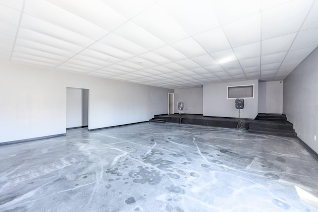 finished basement with a paneled ceiling