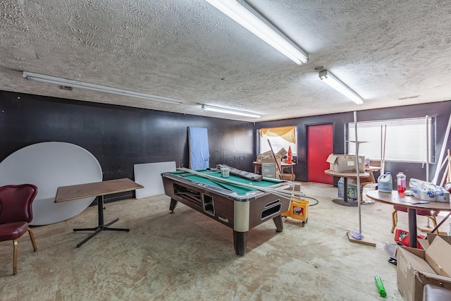 playroom with a textured ceiling