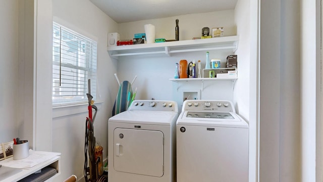 clothes washing area featuring laundry area and washing machine and dryer