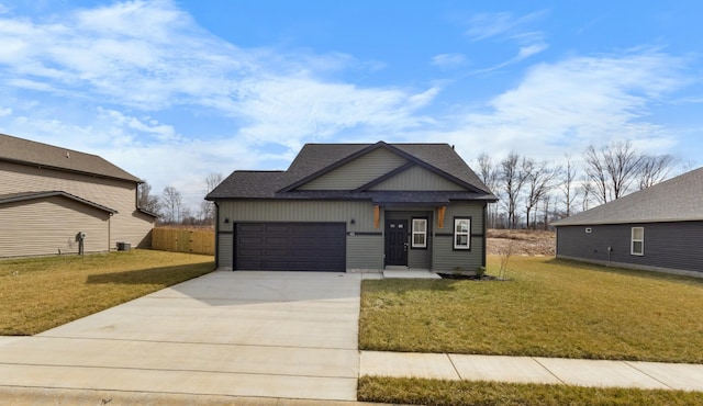 view of front of home featuring a garage and a front lawn