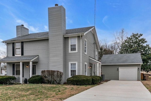 view of front property with a porch, a garage, and a front yard