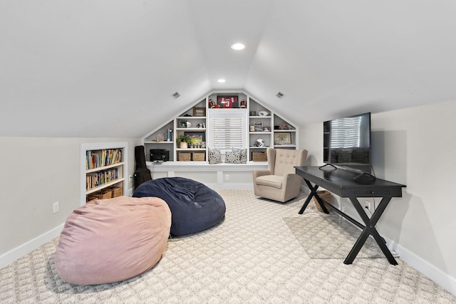 living area with carpet floors, built in features, and vaulted ceiling