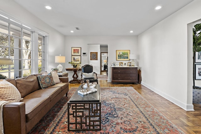 living room featuring parquet flooring