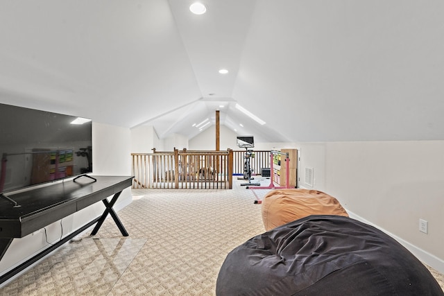 interior space with vaulted ceiling and carpet floors