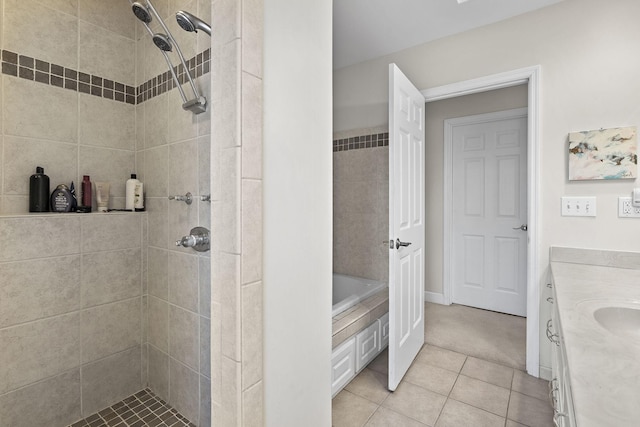 bathroom with tile patterned floors, vanity, and separate shower and tub