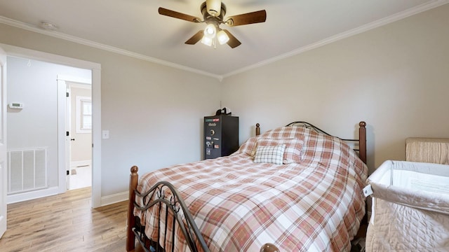 bedroom with visible vents, ornamental molding, ceiling fan, light wood-type flooring, and baseboards