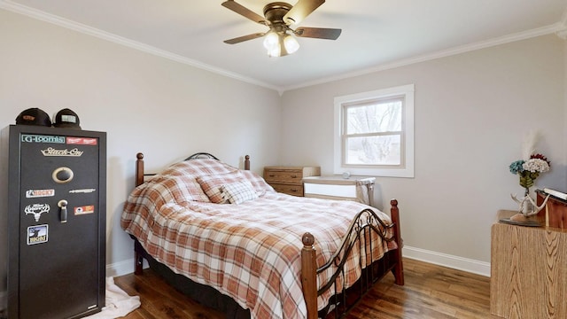 bedroom with ceiling fan, ornamental molding, wood finished floors, and baseboards