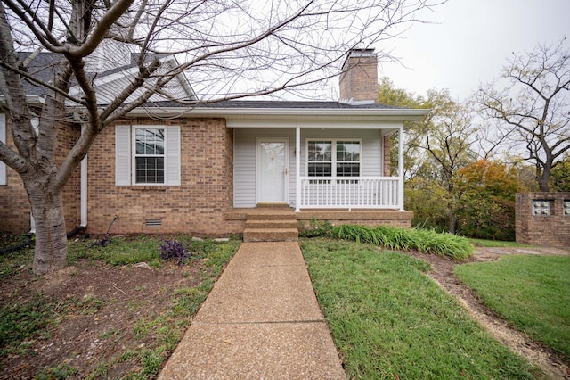 view of front of home featuring a front lawn and a porch