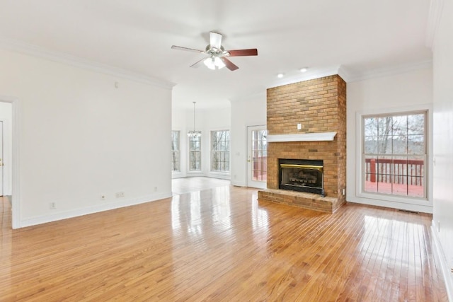unfurnished living room featuring ceiling fan, visible vents, light wood-type flooring, and ornamental molding