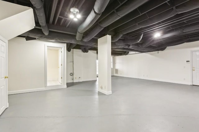finished below grade area featuring visible vents and baseboards