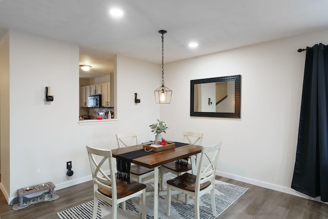 dining room with dark wood-type flooring