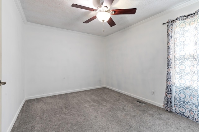 unfurnished room with ornamental molding, carpet flooring, ceiling fan, and a textured ceiling