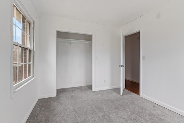 unfurnished bedroom featuring a closet and carpet flooring