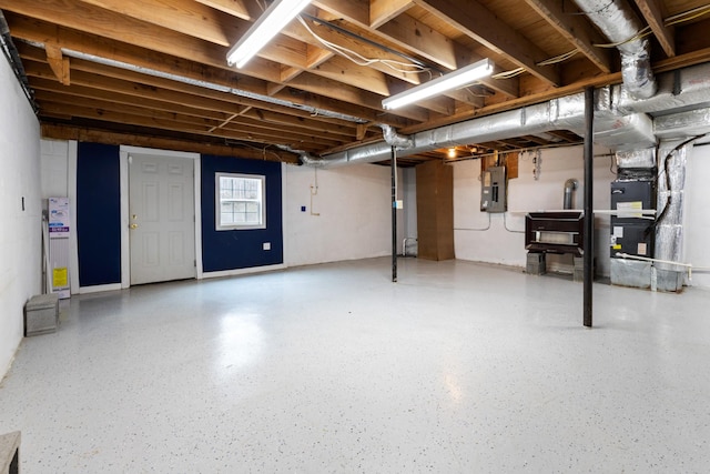 basement featuring heating unit and electric panel