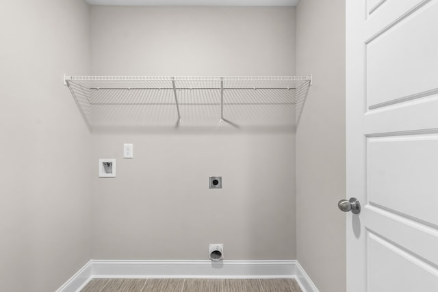 laundry room featuring hardwood / wood-style flooring, hookup for a washing machine, and electric dryer hookup