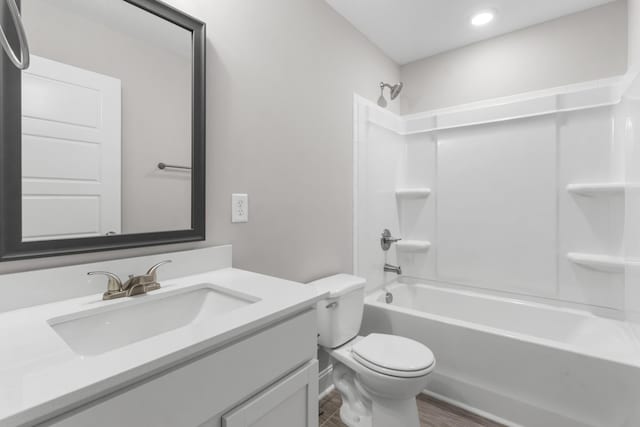 full bathroom with shower / tub combination, vanity, and toilet