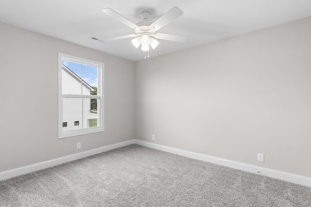 spare room with ceiling fan and carpet flooring