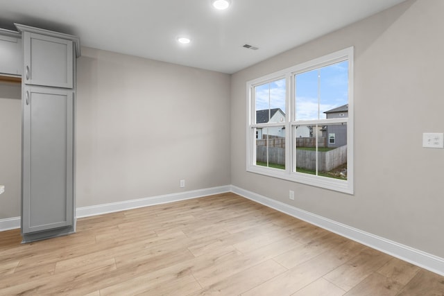 unfurnished bedroom featuring light wood-type flooring