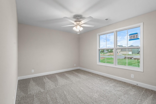 empty room with carpet floors and ceiling fan