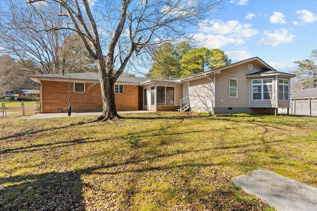 exterior space featuring a sunroom and a front yard