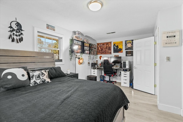 bedroom with wood-type flooring