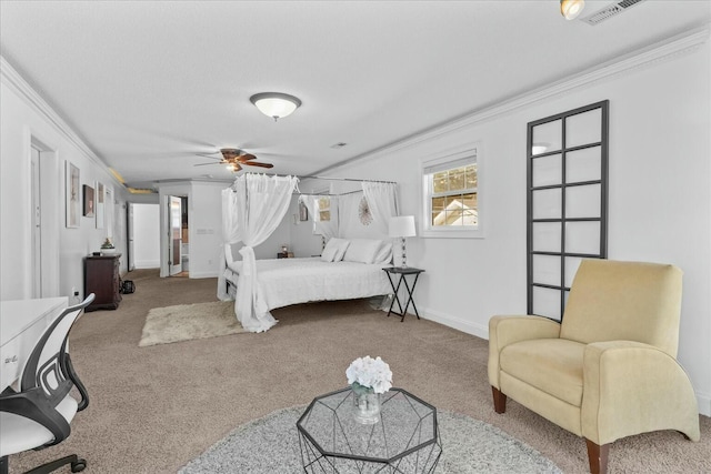 carpeted bedroom featuring ornamental molding and ceiling fan